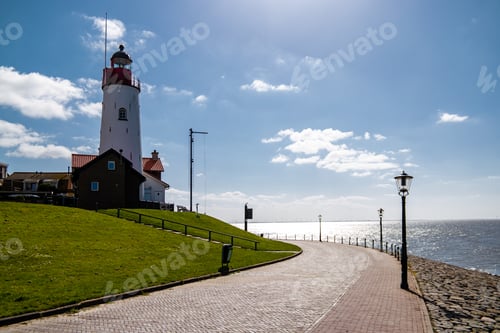 Preview: Urk Flevoland Netherlands sunset at the lighthouse and harbor of Urk Holland