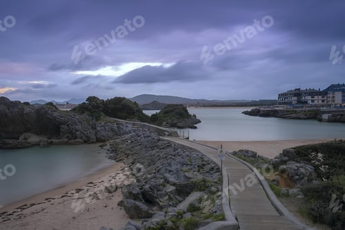 Preview: Cliffs and a boardwalk before the storm on Isla Beach. Cantabria, Spain