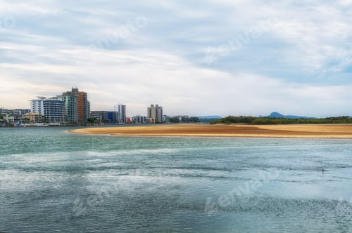 Preview: Coastal city skyline with sandy beach