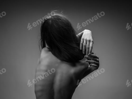 Preview: back of a woman naked body posing black and white photo