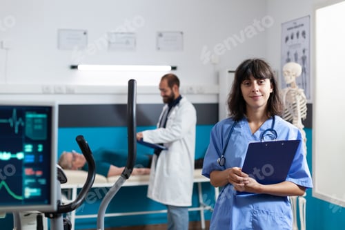 Preview: Portrait of medical assistant standing in physiotherapy office