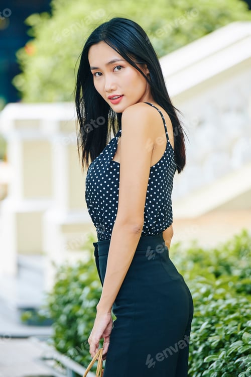 Preview: Beautiful Asian woman outdoors