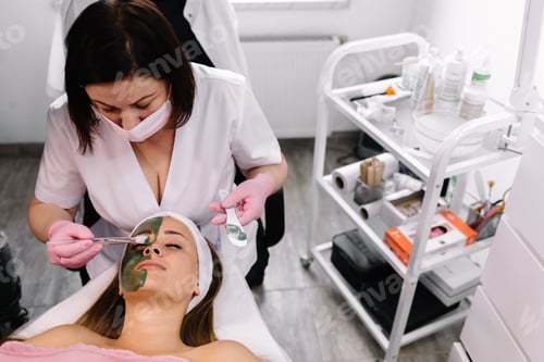 Preview: Beautiful young girl at the beautician does the spa procedures,