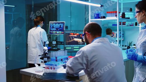 Preview: Scientists coworkers working in chemical equipped laboratory