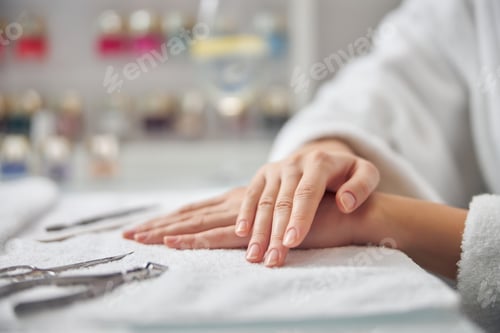 Woman Hands Relaxed on Manicure Towel