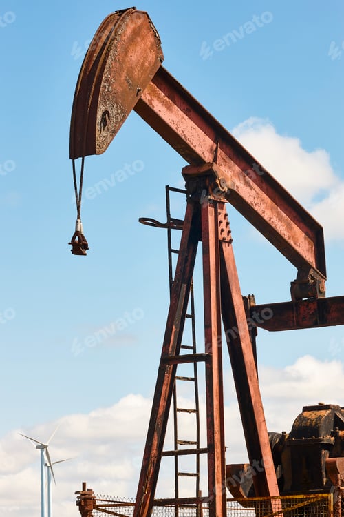 Preview: Oil pumping machine and windmills. Petroleum extraction. Resource