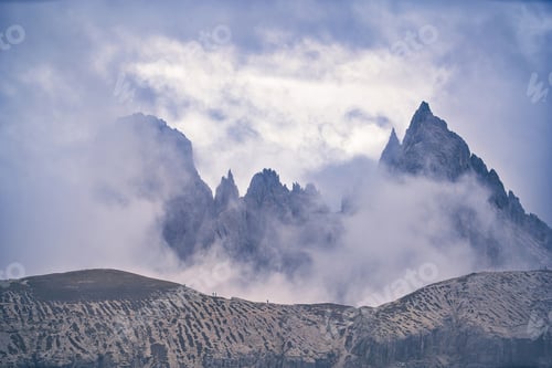 Preview: Dolomites Mountains in clouds at daylight. Italy