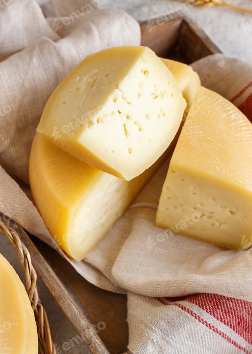 Preview: Pieces of fresh homemade cheese on a tray close up