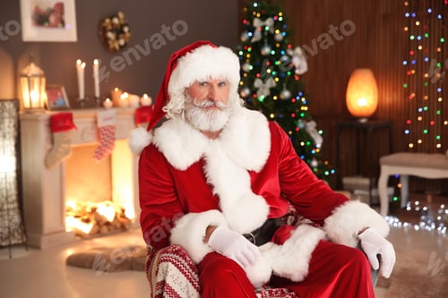 Preview: Santa Claus sitting in armchair at home. Christmas surprise for child