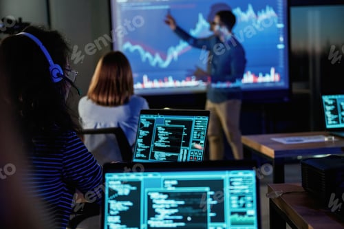 Preview: Male business trainer is against projector with data, teaching people