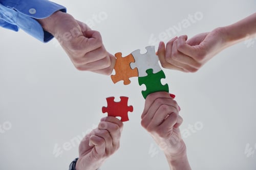 Preview: Group Of Business People Assembling Jigsaw Puzzle And Represent Team Support And Help Concept