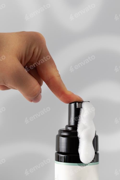 Preview: Lady finger pushes dispenser to get soap foam for bottle