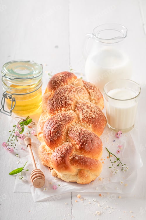 Preview: Homemade and hot golden challah baked in a home bakery.