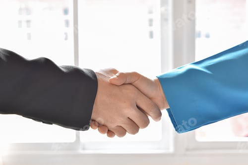Preview: Close-up of businessman and woman hands shake partnership success. Negotiating business concept.