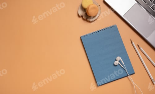 Preview: Autumn office table desk flat lay with blank blue paper note pad, cup, pencil and laptop
