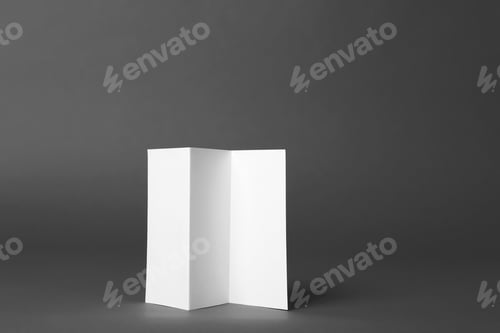 Preview: Blank brochure on dark grey background. Mock up for design