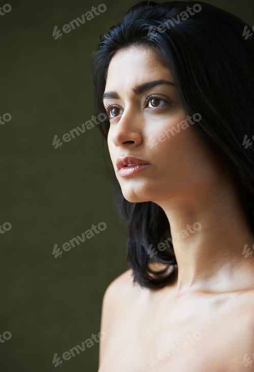 Preview: Pensive young woman in a serene portrait