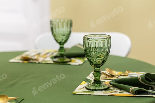 Preview: Dinner table setting idea with textured green glass goblets.