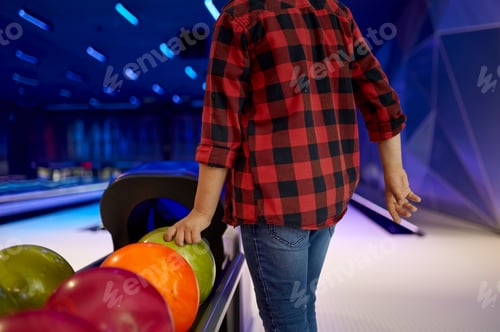 Preview: Boy takes a ball at the lane in bowling alley