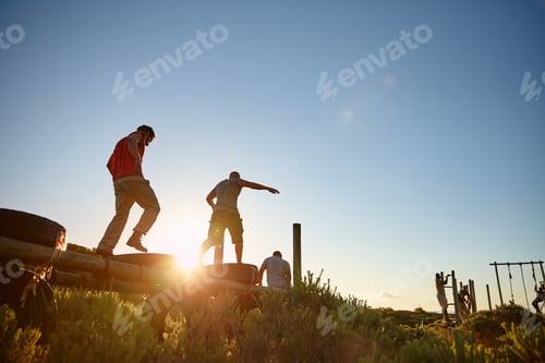 Preview: Theyre getting fighting fit. Shot of men going through an obstacle course at bootcamp.