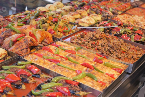Preview: Colorful display of diverse dishes at a food market