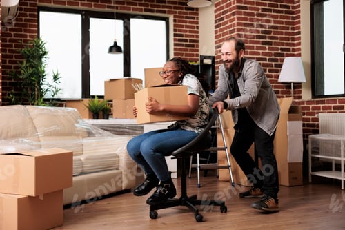Preview: Diverse husband and wife having fun relocating in new household