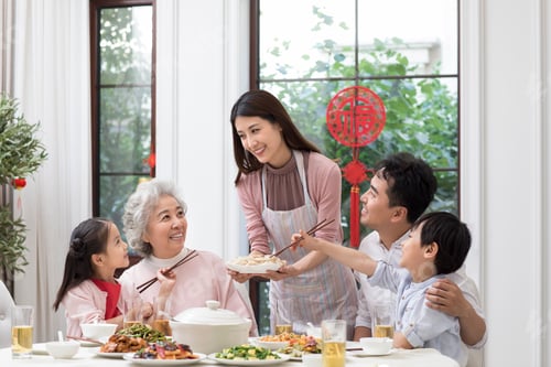 Preview: Happy family having Chinese New Year dinner