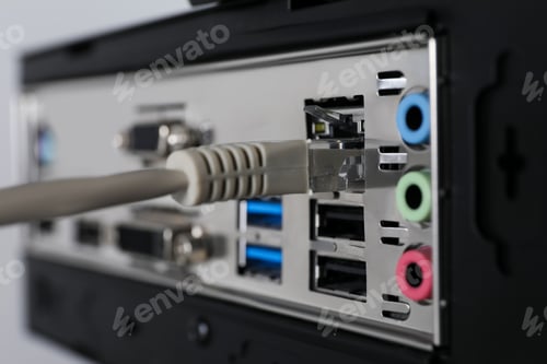 Preview: Connected cable to computer system unit, closeup. Internet communication