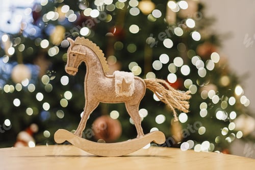 Preview: Happy New Year 2026 ! Christmas horse rustic toy on background of christmas tree