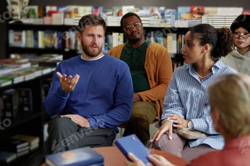 Preview: Diverse Group of Young Adults Engaging in Discussion during Meeting with Author
