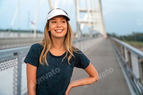 Preview: Portrait of young fit attractive happy fitness woman in city. People healthy lifestyle concept