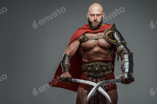 Preview: Bald and bearded gladiator poses standing tall with two swords