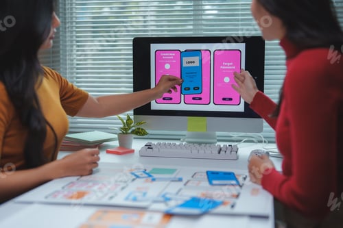 Preview: Web designers working on user interface and user experience of mobile application