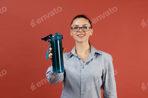 Preview: Successful young modern businesswoman warming up at office while working
