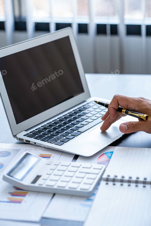 Preview: Business man working on laptop computer searching information and planning startup project in office