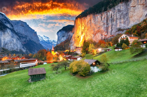 Preview: Dramatic autumn view of Lauterbrunnen valley with gorgeous Staubbach waterfall and Swiss Alps