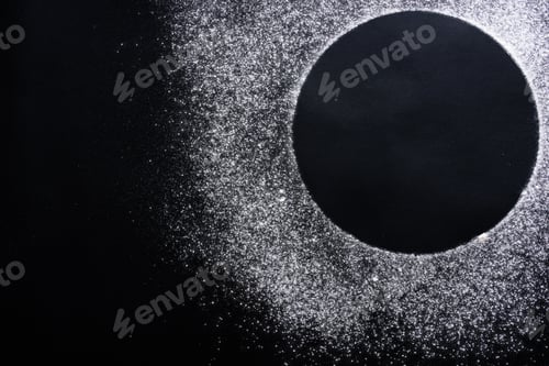 Preview: Abstract background. Sprinkled wheat flour circle, round spot on black
