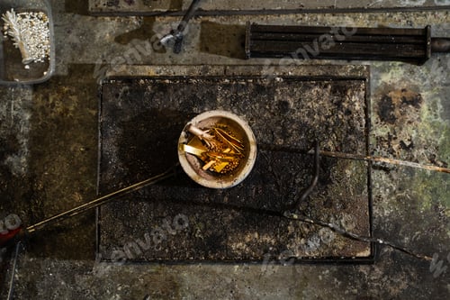 Preview: Gold and alloy materials arranged in a crucible before melting.