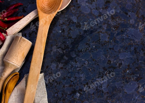 Preview: Old wooden kitchen utensils or cooking tools and bowls on gray background, top view, flat lay. Kitch