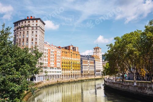 Preview: View of the city of Bilbao, the Nervion river and its colorful architecture on a sunny day