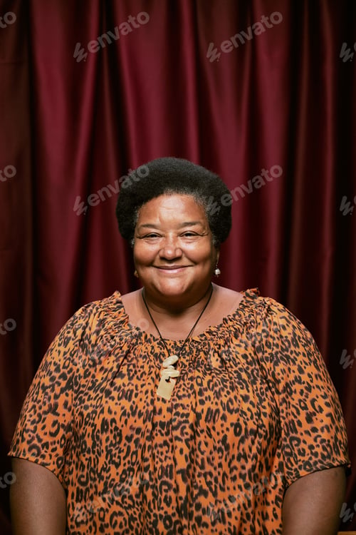 Preview: Portrait of Middle Aged Black Woman Smiling in Photo Booth Setting