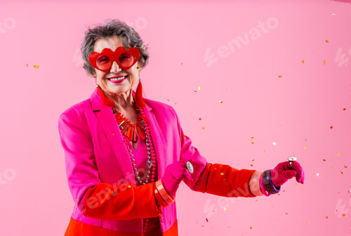 Preview: Happy and funny senior old woman on colorful background