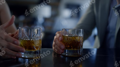 Preview: Newlyweds couple hands drinking whiskey closeup. Unknown spouses dating