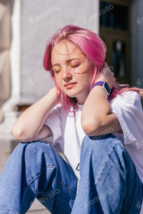 Preview: Portrait of a teenage girl with pink hair.