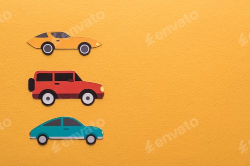 Preview: top view of paper cut cars on orange background with copy space