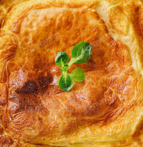 Preview: Delicious pie with meat and basil on wooden table, flat lay