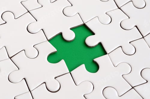 Preview: Close-up texture of a white jigsaw puzzle in assembled state with missing elements formi