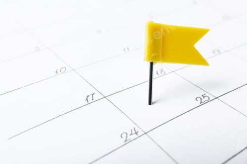 Preview: Calendar page marked with drawing pin, closeup