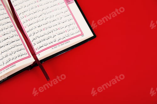 Preview: Quran and space for text on color background, top view. Muslim tradition