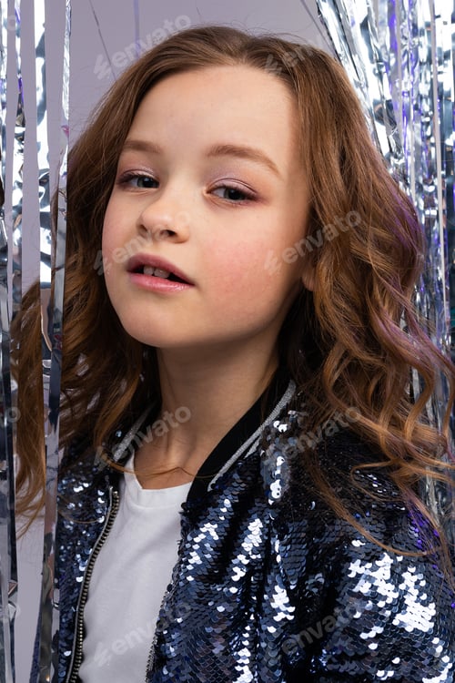 Preview: Closeup portrait of a stylish teenage girl on shiny sparkling background